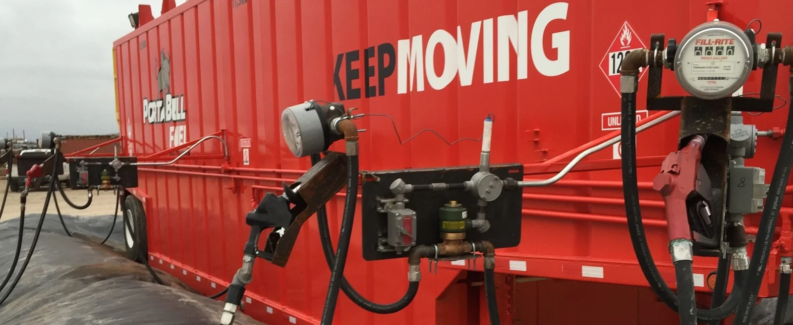 White Keep Moving lettering on a red fuel container